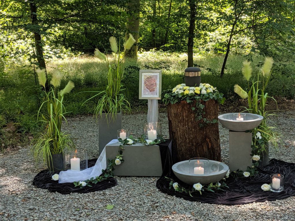 My dad's urn with some flowers around it