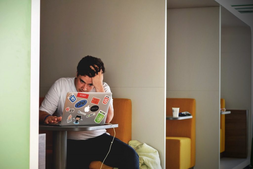 Frustrated man on laptop