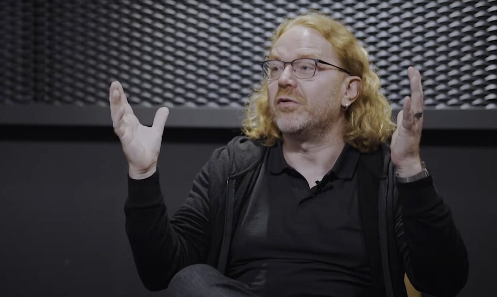 Chris Heilmann on stage with his hands in the air